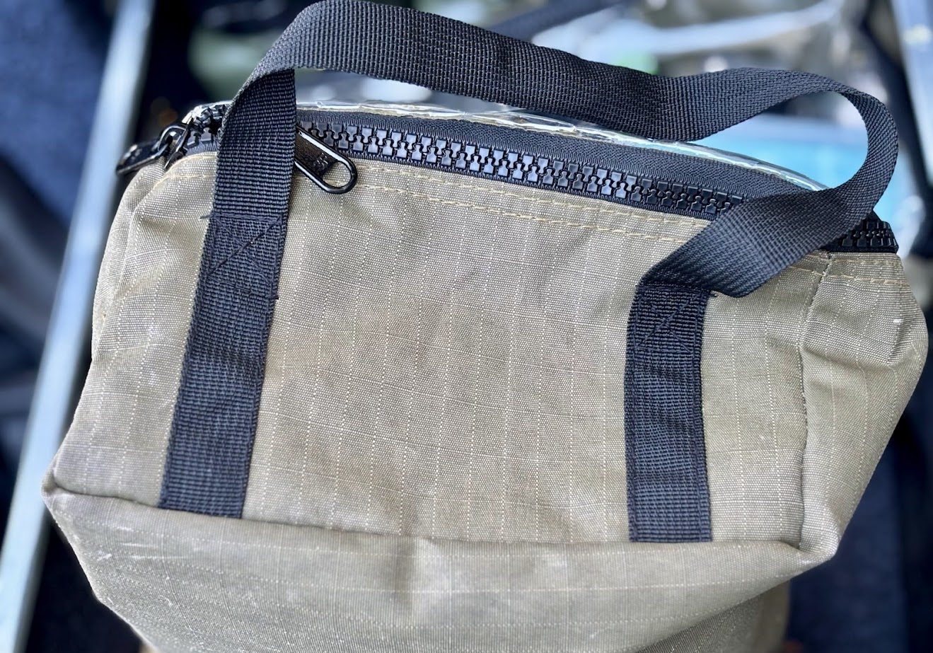 The reinforced carry handles on the Kings canvas clear top bag​s allow you to pull a full bag out of the drawer easily