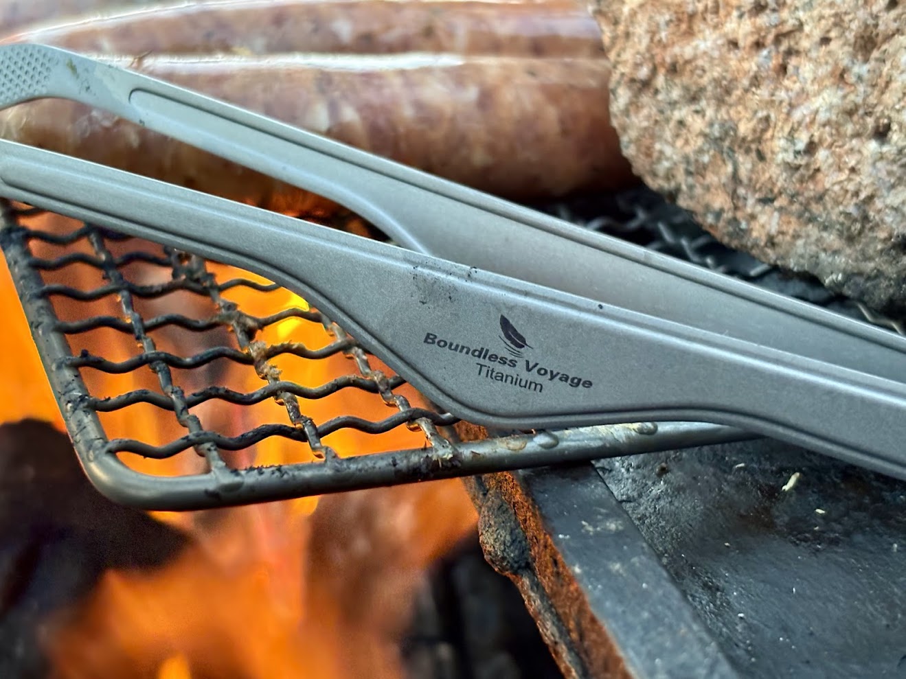 Using the titanium tongs​ from Boundless Voyage in combination with a titanium grill plate