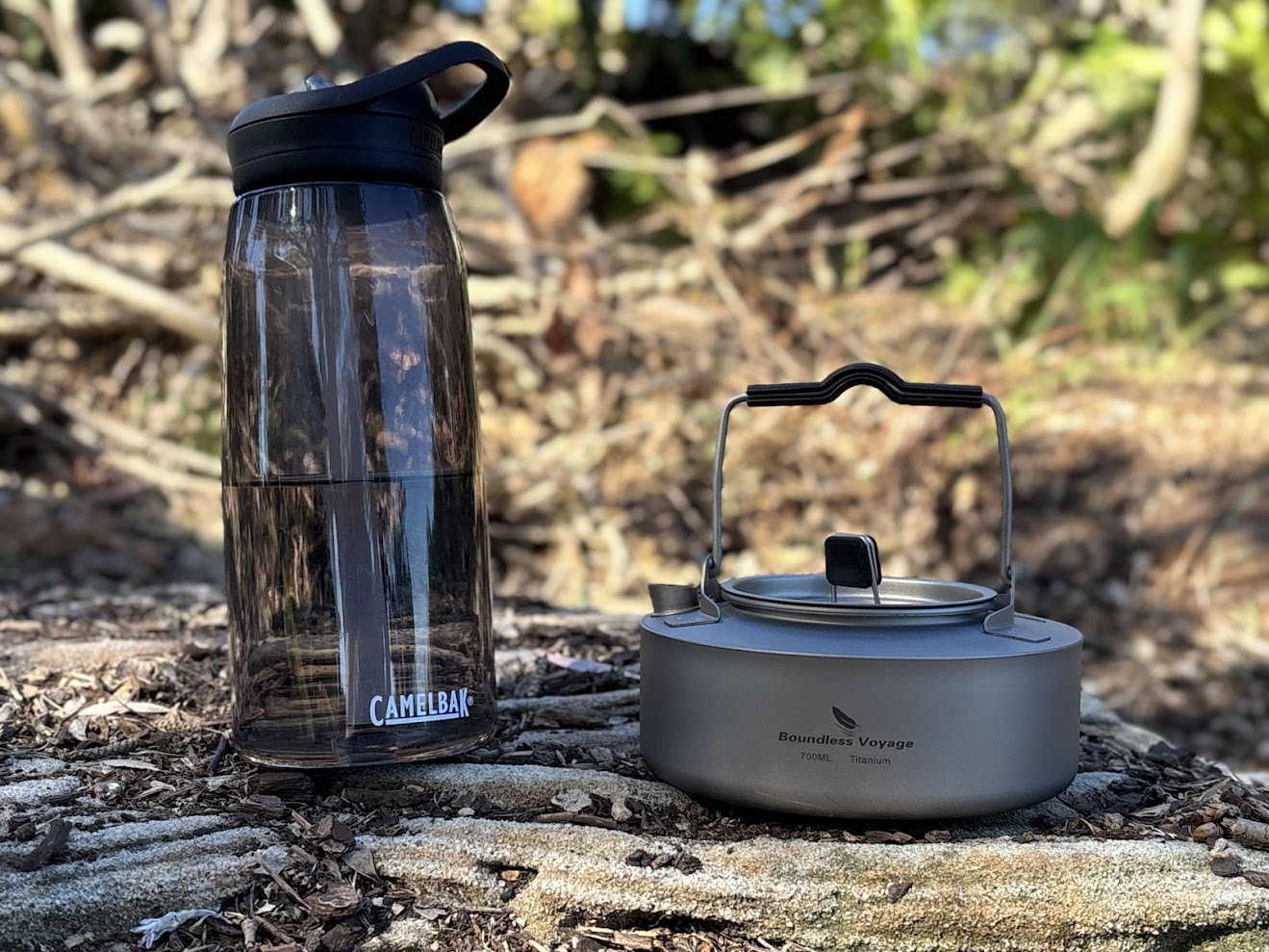 The Boundless Voyage titanium camp kettle​ (700ml) it truly compact, here compared to a 22cm high water bottle