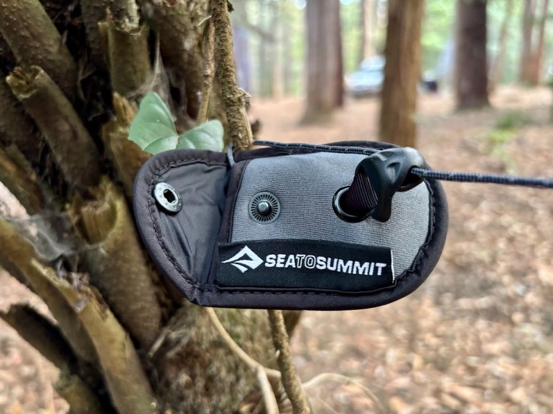 Since one end of the Sea to Summit clothesline is fixed to the pouch, you simply attach it to anything around camp using the build-in hook