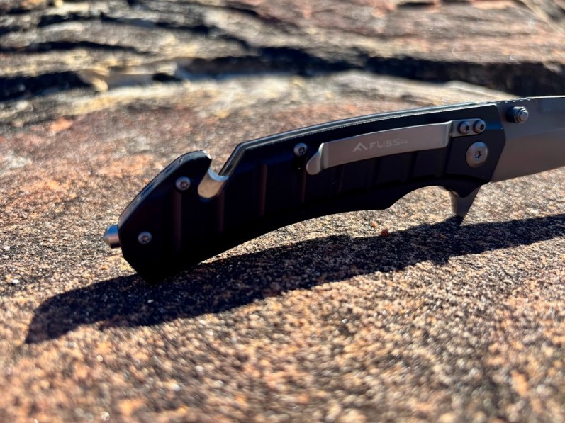The integrated steel glass breaker and seatbelt cutter at the base of the handle are incredibly smart inclusions on the Flissa folding knife