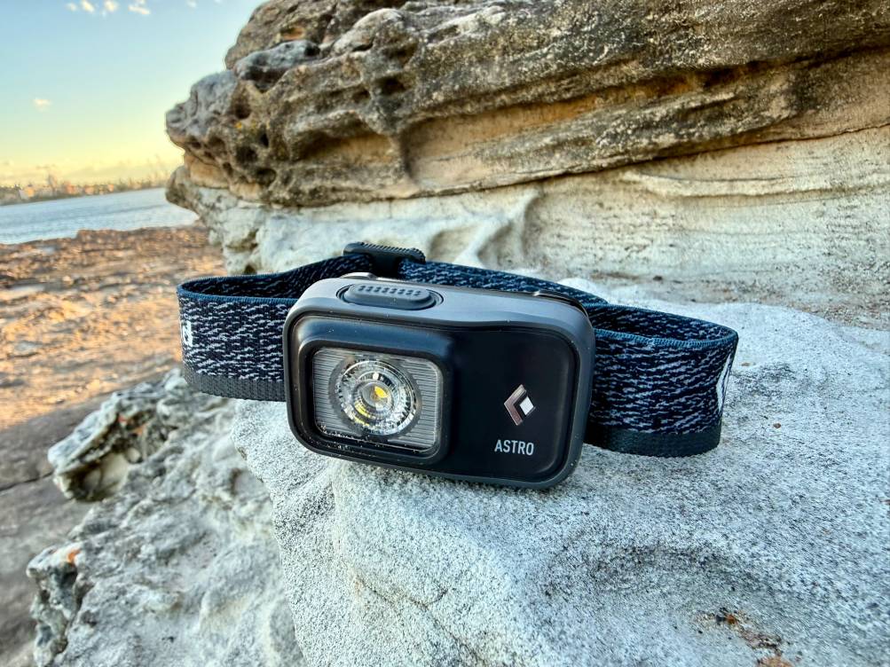 The Black Diamond Astro 300 headlamp has one single button to cycle through the low, medium, and max settings (hold the button for dimming or strobe)