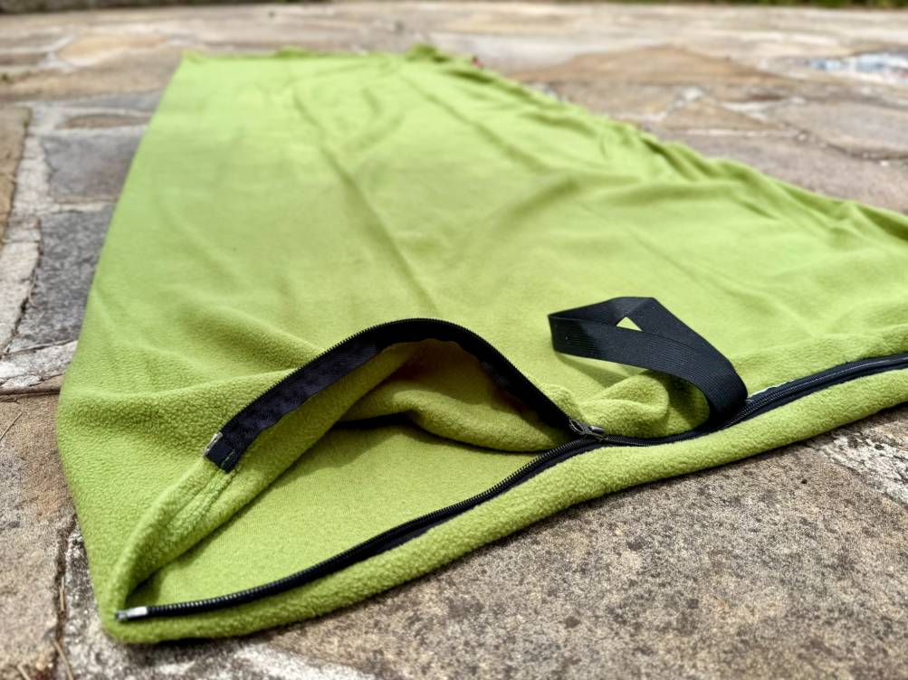 The Coleman Stratus Fleece Sleeping Bag Liner comes with a two-way zipper that allows you to adjust ventilation from the top or bottom