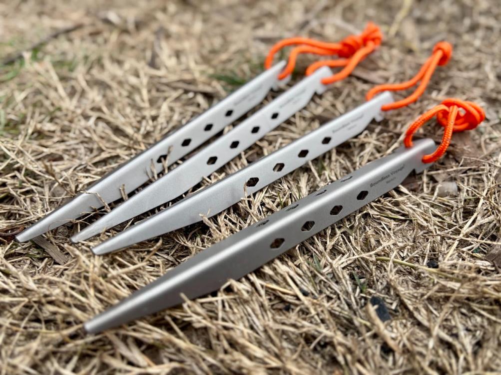 The V-type design of these titanium tent pegs are robust and the sharp pointed end penetrates most ground types with ease