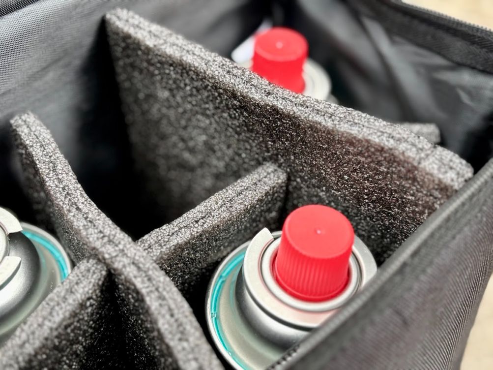 The internal foam divider inside this butane gas canister storage bag is quite thick and creates individual padded slots for each of the six canisters