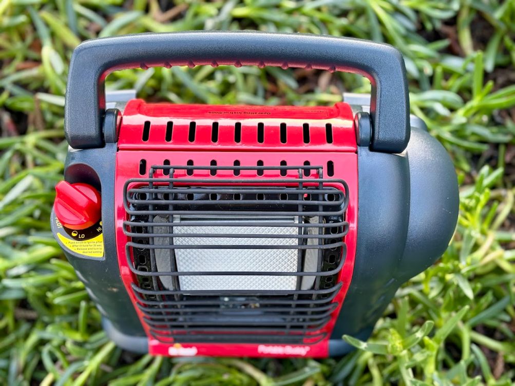 The main housing of the Mr Heater Portable Buddy is constructed from rugged plastic and metal components that protect the internal gas connections and the sensitive ceramic heating element