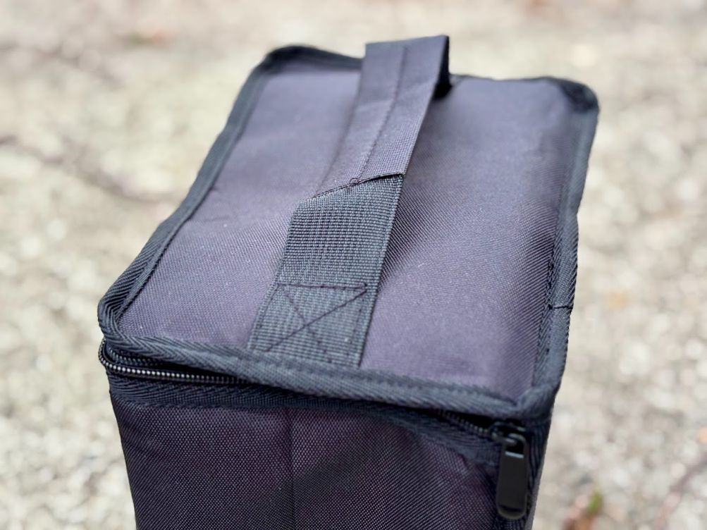This butane gas canister storage bag features a reinforced carrying handle on top for safely transporting the canisters